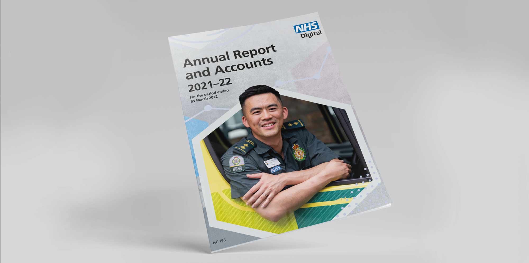 The cover of the NHS Digital Annual Report and Accounts 2021–22, featuring a paramedic smiling in front of an ambulance.