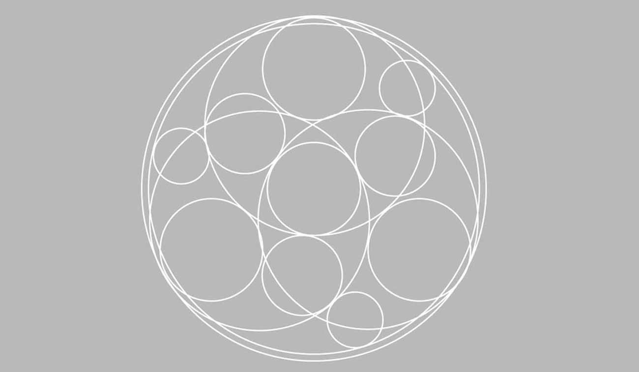 A circular design composed of intersecting white circles on a grey background, representing the Universities Partnership logo.