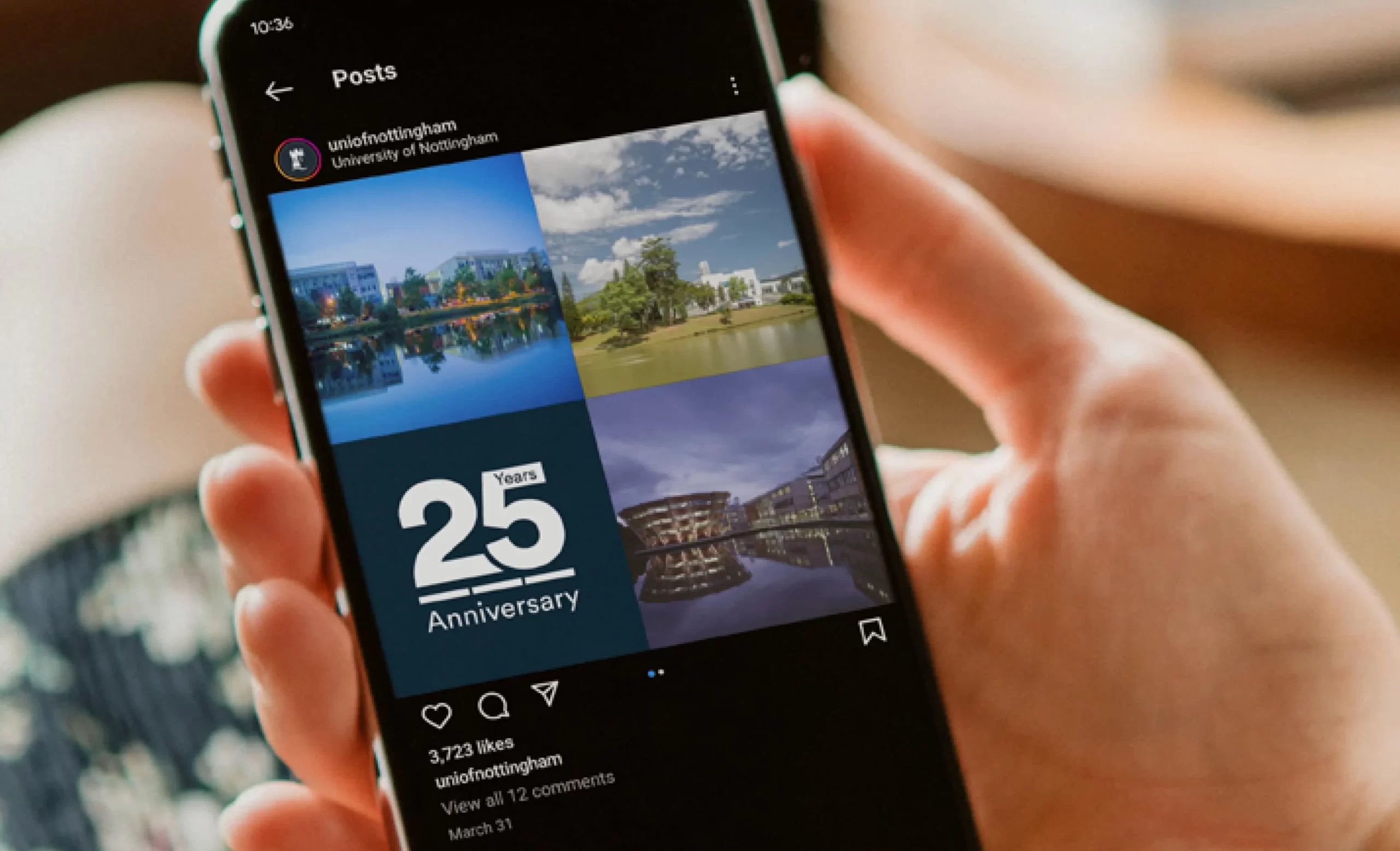 A person holding a mobile phone, displaying a social post from the University of Nottingham. The post celebrates Nottingham University Business School’s 25th anniversary, with a grid of four images showing different views of the campus alongside the 25 year anniversary logo.