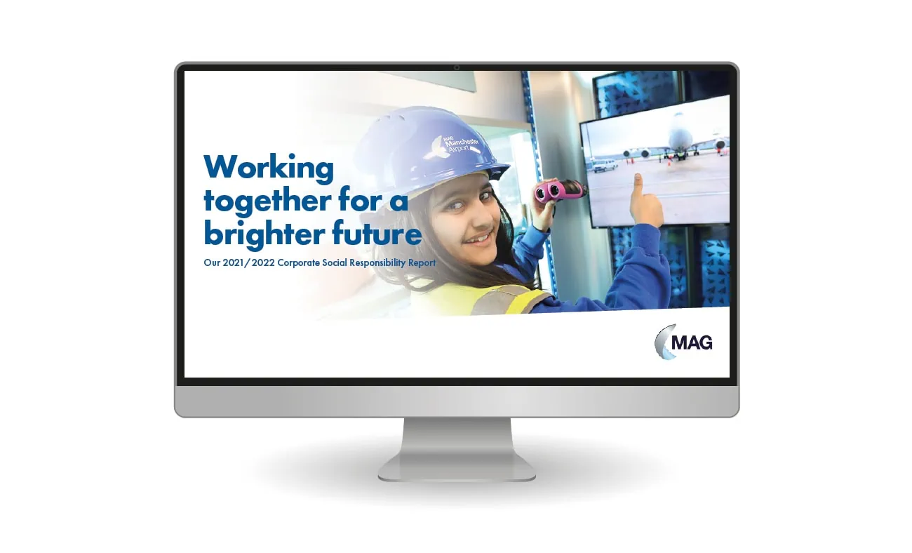 A digital version of Manchester Airport Group's Corporate Social Responsibility report displayed on a monitor.