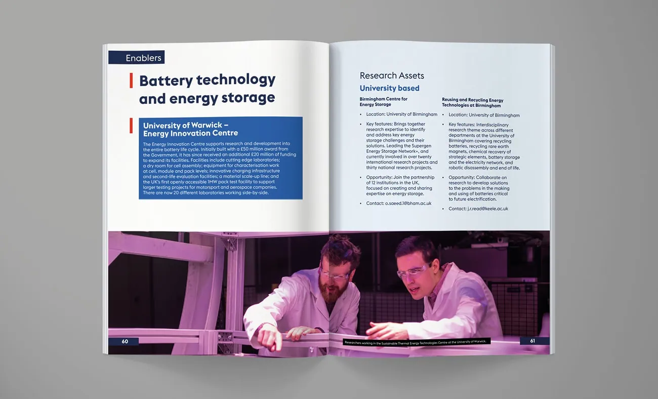 A double-page spread highlighting battery technology and energy storage advancements. It features detailed text about research assets and university-based initiatives, accompanied by an image of two scientists collaborating in a laboratory.