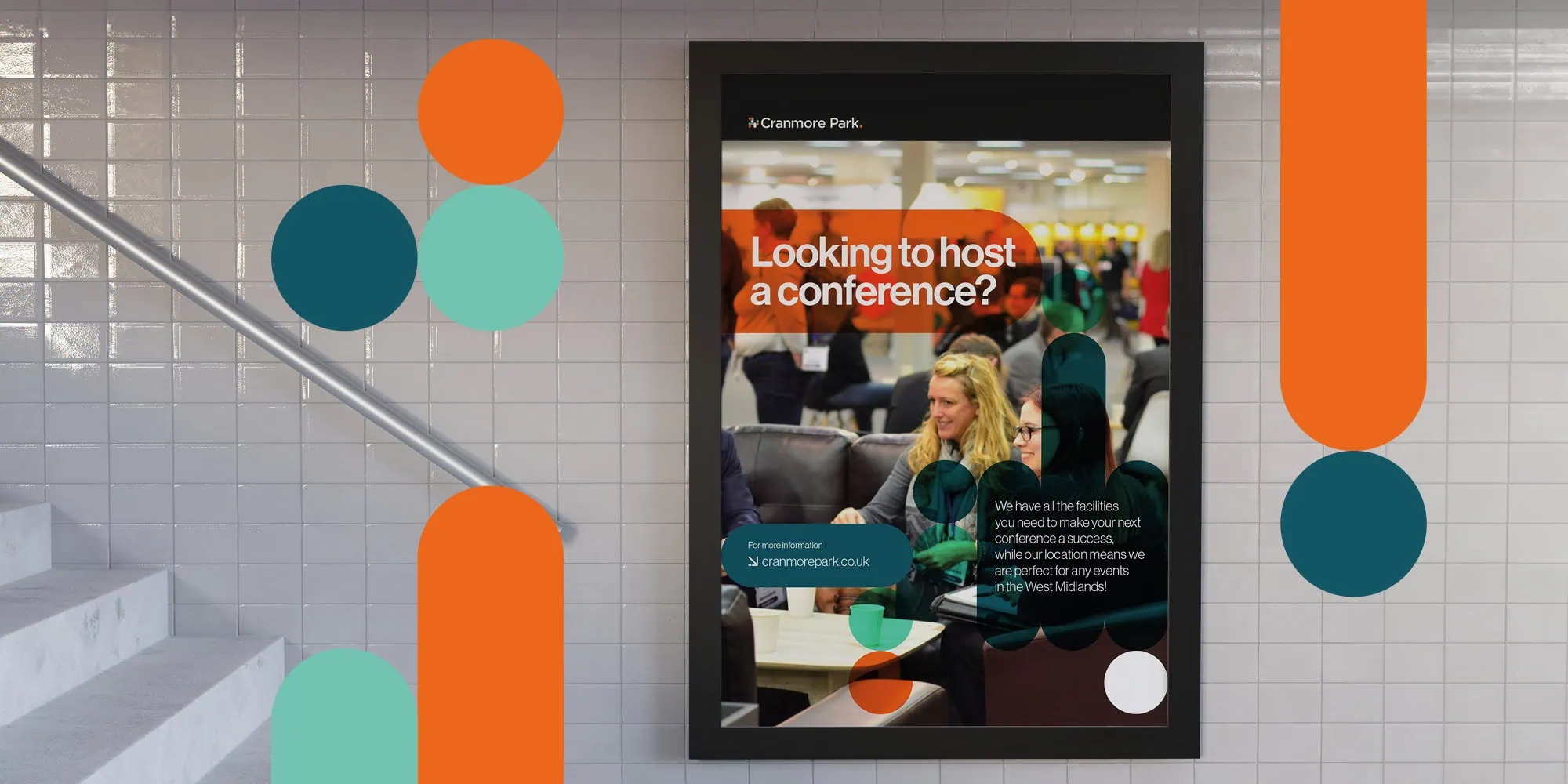 A digital poster for Cranmore Park displayed on a tiled wall, featuring the text "Looking to host a conference?" over an image of people networking, with geometric accents in teal, orange, and grey.